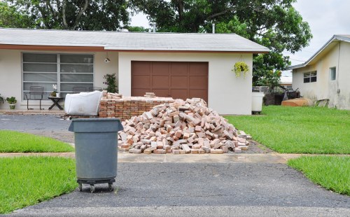 Workers segregating recyclable materials during clearance